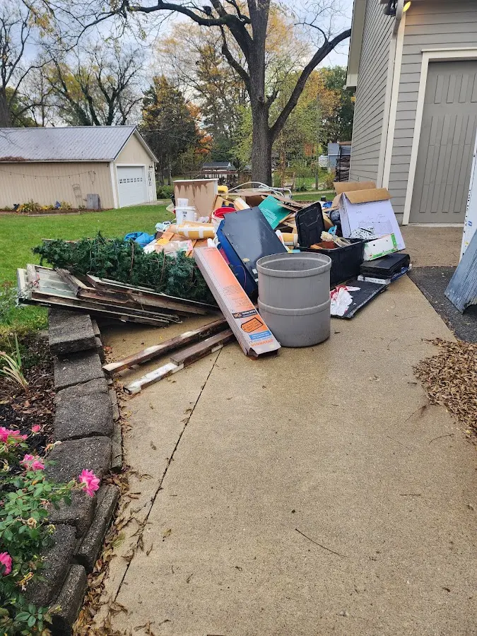 Dumpster being loaded with debris for Estate Cleanout Dumpster Rental in West Norriton